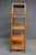 Ethan Allen faux bamboo etagere with four rattan shelves. Classic, lightweight look that works well for books, decor, or...