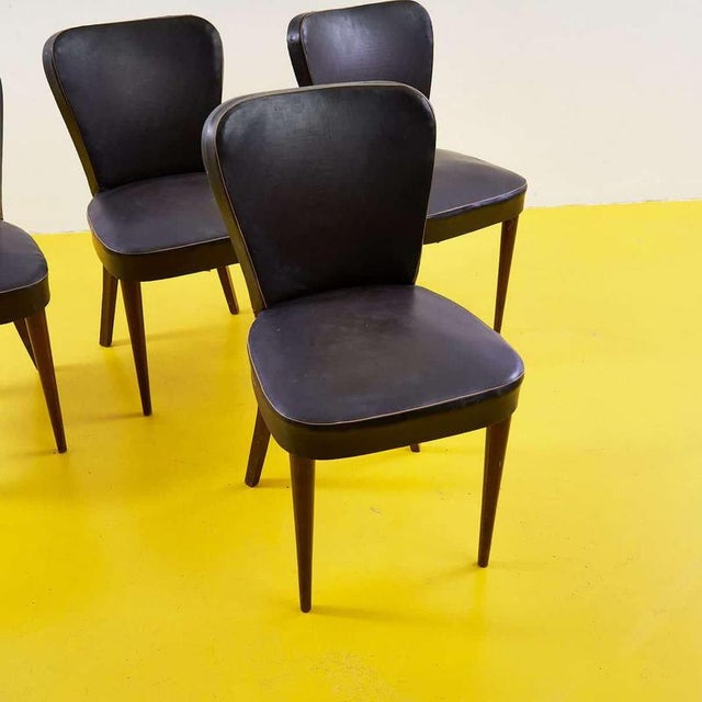 Item : this elegant set of four 1950s chairs is a flawless example of mid-century design. Each chair features a sturdy...