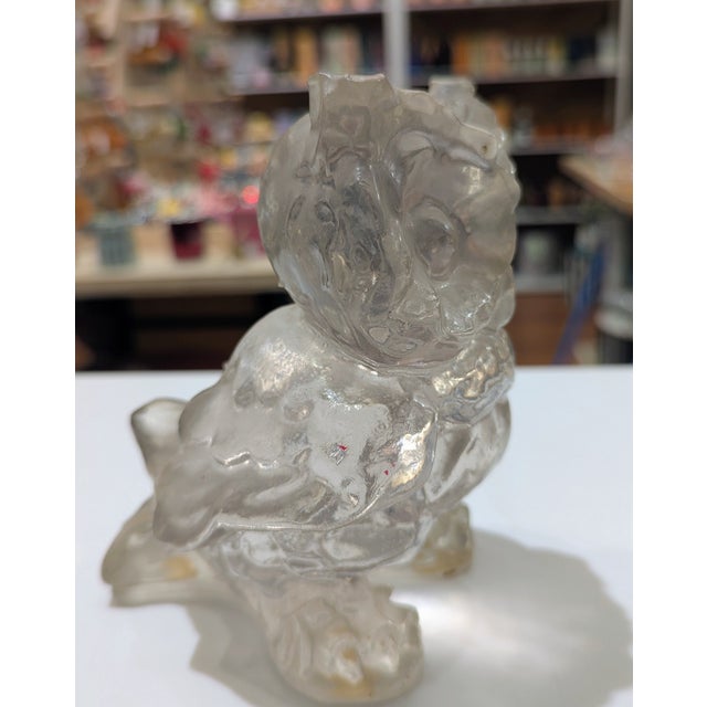 Cast translucent resin owl with textured body and polished facial planes. This owl has seen things. Cast in translucent...