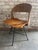 Arthur Umanoff swivel desk chair with signature rush back, slatted wood seat, and iron legs, 1950s. This chair is...