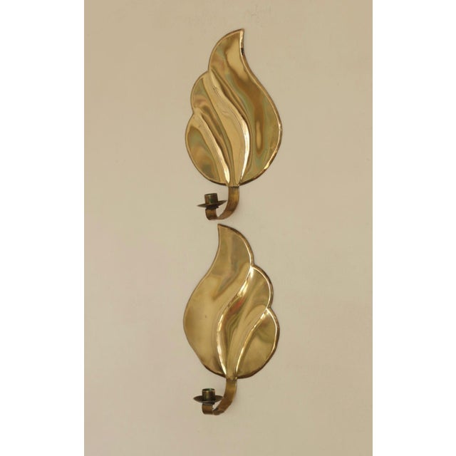 Stunning pair of Swedish brass sconces, featuring beautiful detailing. Both sconces are in very good vintage condition...