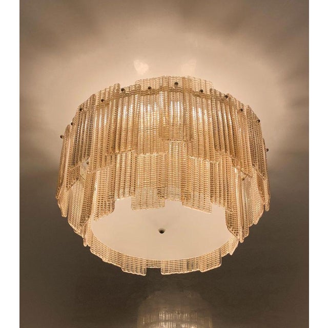 Marea chandelier 6-light in polished chrome and crystal glass by aggiolight. Dimensions: d 55 x h 38 cm. Materials: metal...