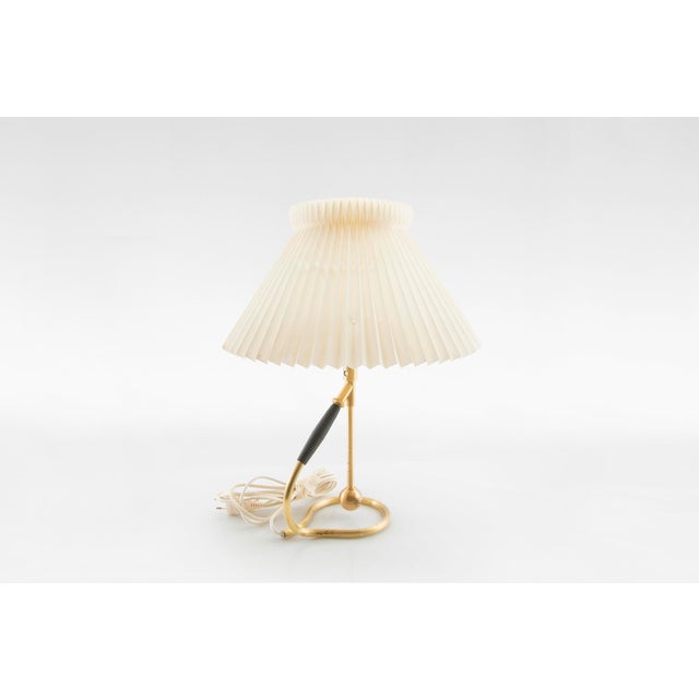 Vintage le klint model 306 table lamp designed by kaare klint, denmark, 1950s. Featuring an elegant brass base with an...