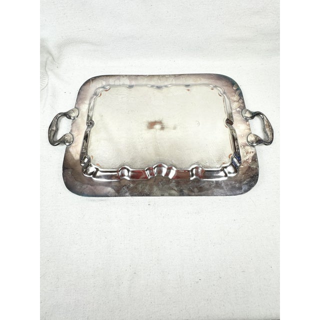 Beautiful and ornate vintage serving tray. Features a grapvine design. Made of silver on copper or “silverplate”. A...