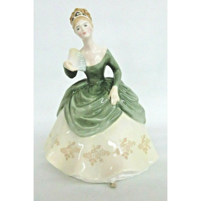 This gorgeous Figurine is made of bone china / porcelain. This very collectible figurine is stamped as having been made in...