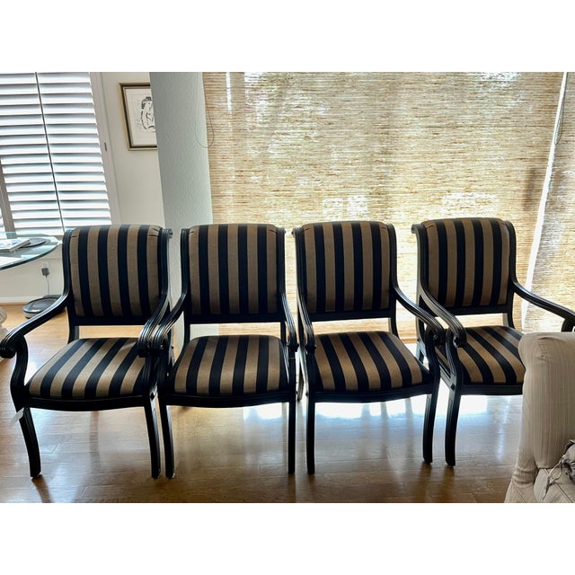 These Kreiss dining chairs were just pulled out of storage! Beautiful Jim Thompson black and gold striped fabric covers...