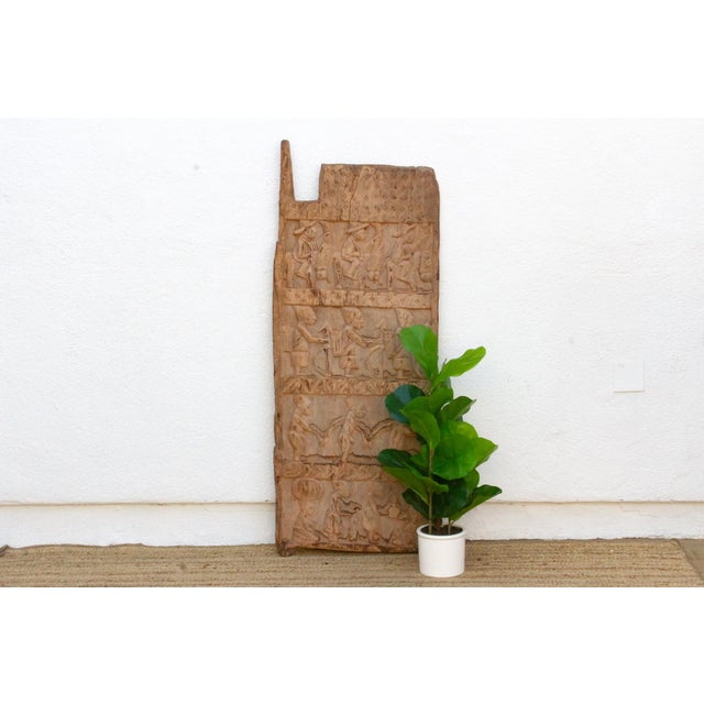 This 53-inch door (height excludes the carved top finial) is a monolithic single-slab Yoruba piece, most consistent with...