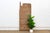 This 53-inch door (height excludes the carved top finial) is a monolithic single-slab Yoruba piece, most consistent with...