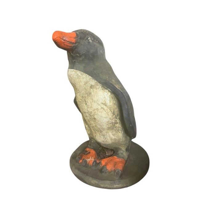 A vintage cast-stone penguin statue. This piece features a wonderful, authentic weathered patina that only comes with...