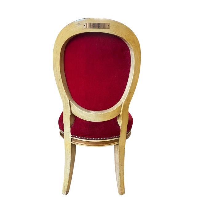 An exceptional Louis XVI-style giltwood side chair bearing its original engraved brass identification plaque from the...