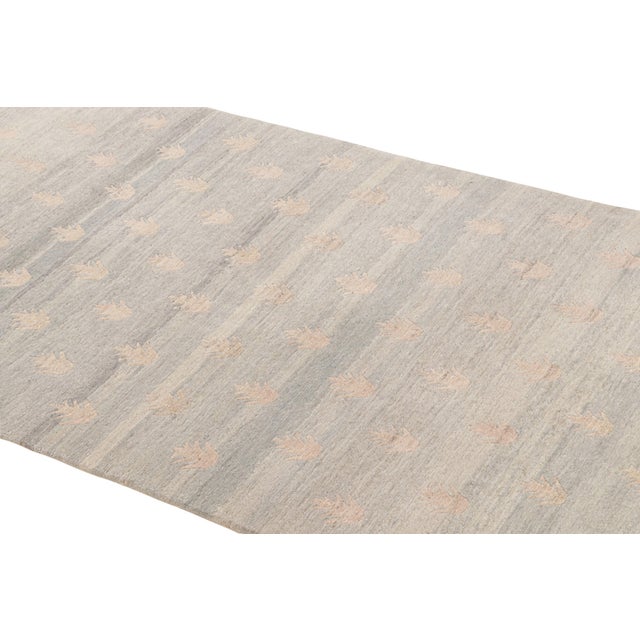 Hand knotted with durable wool originating from Nepal, this contemporary wool rug features a unique geometric Youngste...