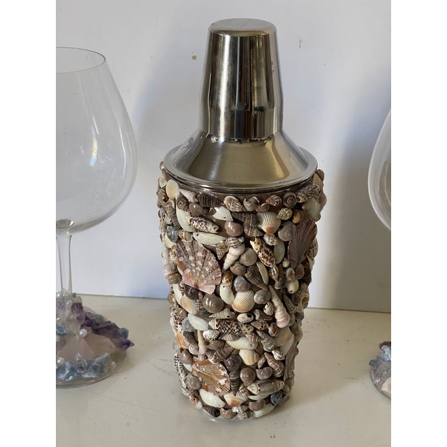 Mid 20 th c sea shells encrusted cocktail shaker and pair of vine glasses encrusted with mineral stones.