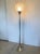 Floor lamp by Angelo Brotto for Luci 60's in nickel-plated brass, transparent glass globe "corteccia" processing. This...