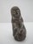 Traditional South American hand-carved stone Pachamama figurine. Depcicts a hooded figure with carvings and incised white...