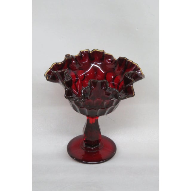 This gorgeous Candy / Compote Bowl is made out of glass. This lovely piece has an exquisite ruby red color to the glass...