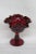 This gorgeous Candy / Compote Bowl is made out of glass. This lovely piece has an exquisite ruby red color to the glass...