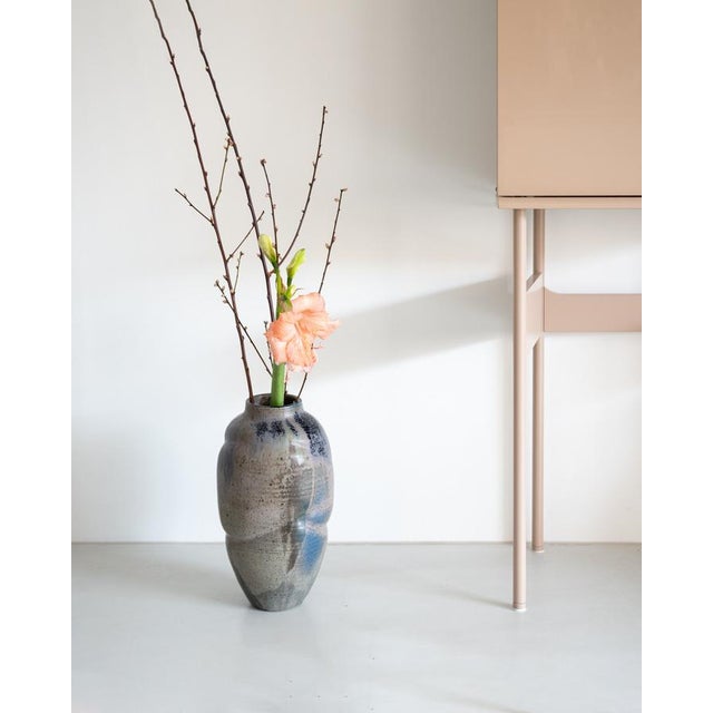 Large hand-thrown stoneware vase by Swiss studio potter Daniel Achermann with a gas reduction Raku glaze in layered tones...