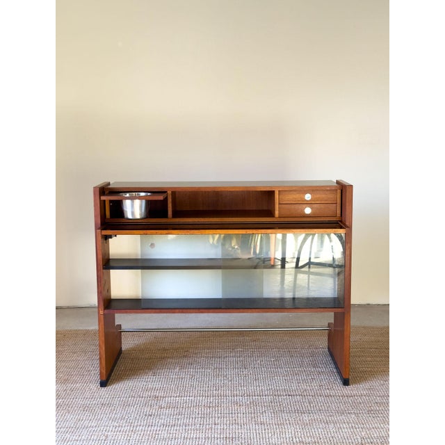 Glass & Teak Drinks Bar by Erik Buch for Dyrlund, Denmark, 1960s, in Very Good conditions. Designed 1960 to 1969 I have...