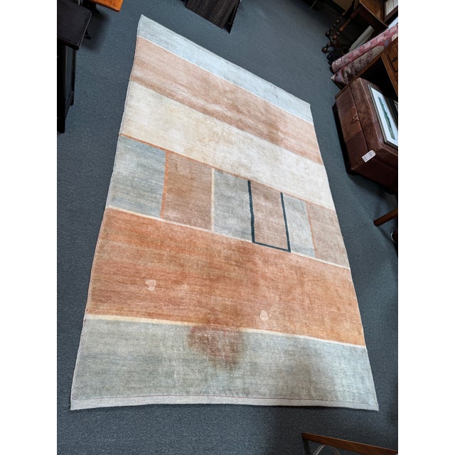 Design Plus Gallery presents a 6ft 1in × 9ft 4in Post Modern Geometric Area Rug. The rug presents a geometric composition...