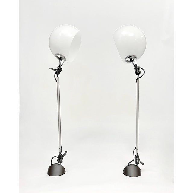 The lamps are part of the "aggregate" lamp system designed by Enzo Mari for Artemide in 1974. The system featured a series...