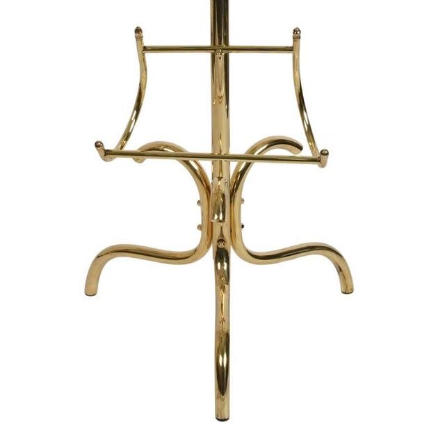 Elegantly combining function with sculptural design, this Mid-Century Modern gentleman's butler offers a sophisticated...