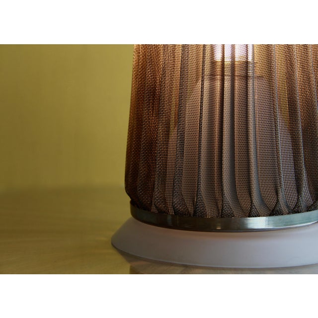 Zan-Zo is a rare table lamp featuring a blown, glazed natural crystal base and a chrome - pleated brass net shade....