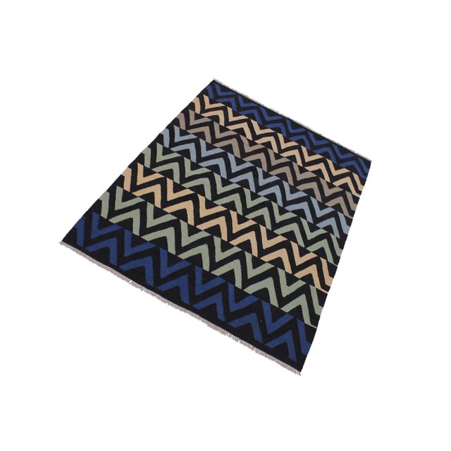 "Add a touch of elegance to your home with this casual chic hand woven Tribal Kilim Hand-Woven Wool Rug. Constructed on a...