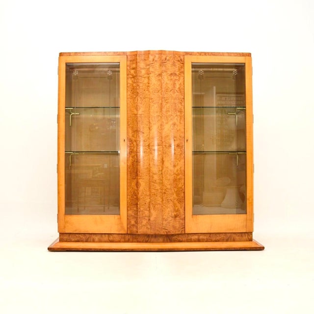 An outstanding Art Deco burr walnut and sycamore bookcase / cabinet by Epstein. This was made in England, it dates from...