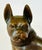 Bronze French bulldog figurine, featuring a rich brown patina and a detailed collar around the neck.