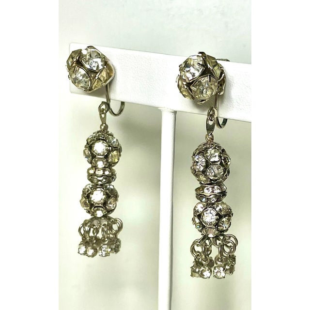 This is part of Chairish’s Costume Jewelry assortment. These are stunners. Swarvorski clusters create a dangling statement...