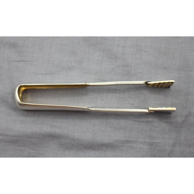 Russian 875 standard silver ice tongs, 1908-1917. Tulip tip with gripped interior. Matte finish with gilded interior....