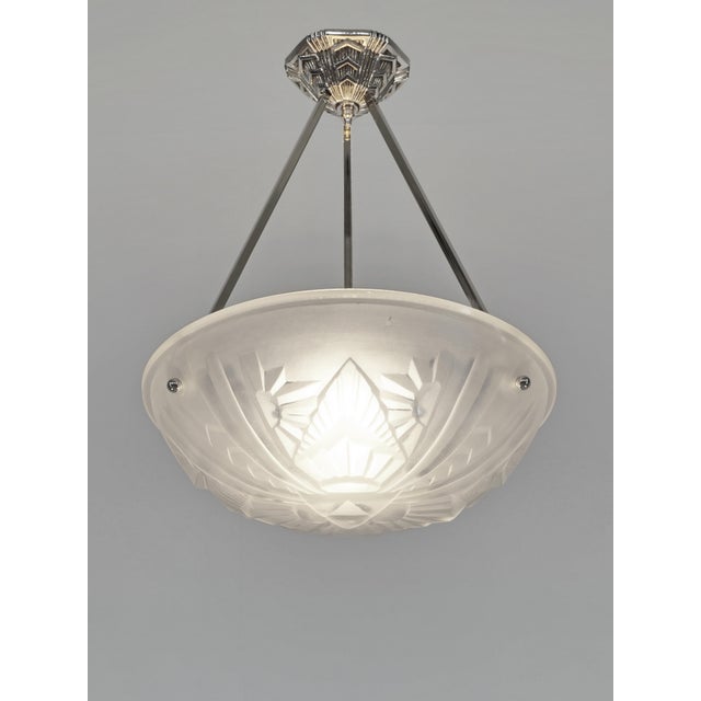 Henri Mouynet & Degué A wonderful French art deco pendant in nickel plated solid brass or bronze and molded-pressed glass....