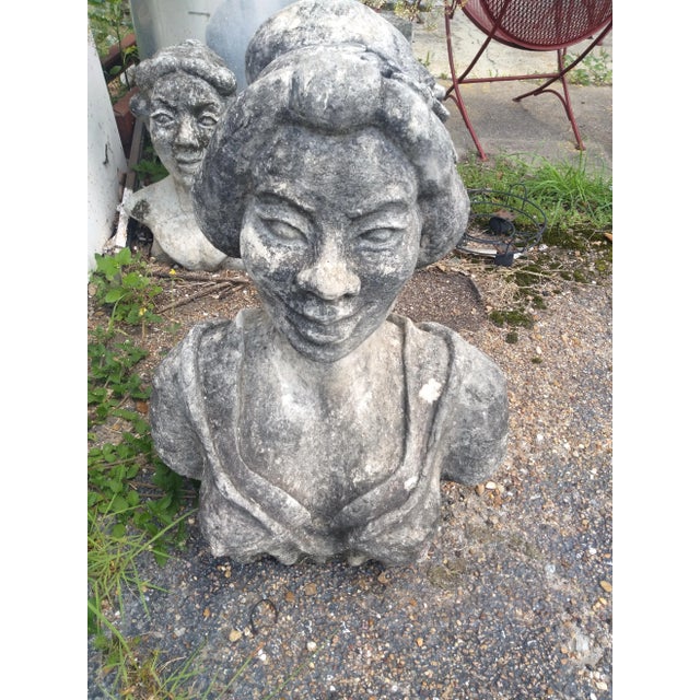 A very nice sculpture of a Haitian woman. A very good addition to any garden or patio area. Nicely crafted.