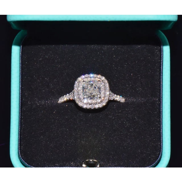 Genuine Tiffany & Co. Soleste 950 solid platinum 1.30CTS diamond ring. This gorgeous double halo engagement ring features...
