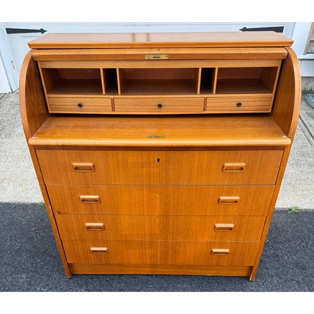 A mid-century modern teak(?) roll top cylinder desk. I believe this was made in Sweden but I could not find a label. Desk...