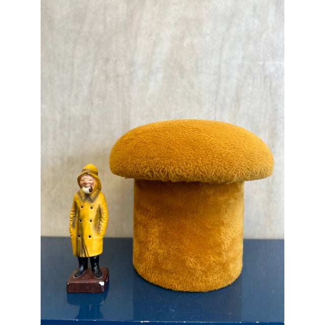 Hard not to smile when you look at this flashback stool or ottoman; in its brave and individual orange shag texture. The...