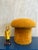 Hard not to smile when you look at this flashback stool or ottoman; in its brave and individual orange shag texture. The...