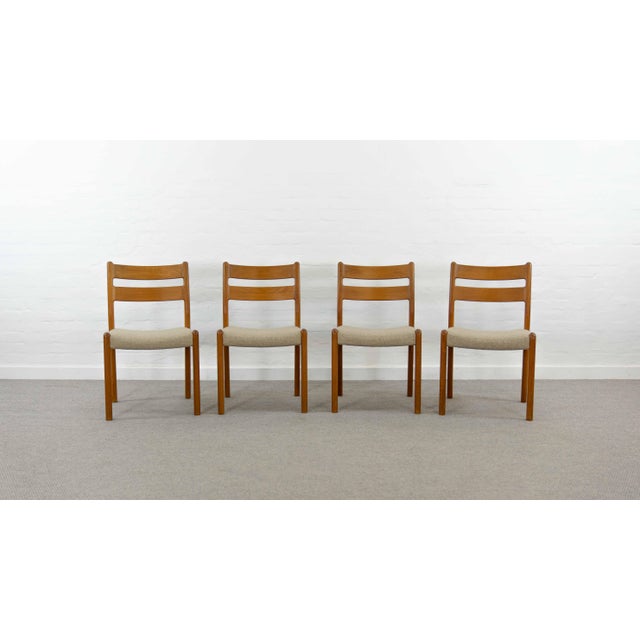 Mid Century set of 4 chairs in solid teak from EMC-Mobler Denmark. Covered with original mottled wool fabric. Reasonable...