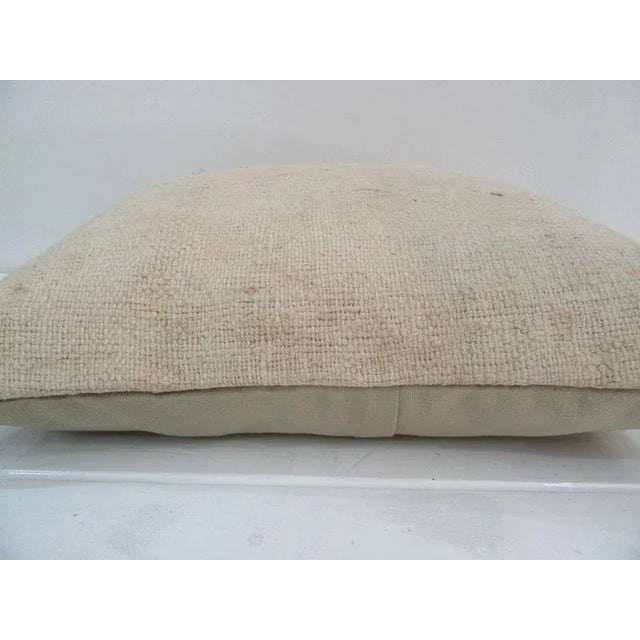 This is a pillow cover made from a vintage kilim rug. The piece was properly washed and ready to use. Pillow inserts not...