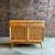 This piece is a Heywood Wakefield small credenza or buffet with a wonderful wheat finish. It features sculptural angled...
