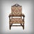 This upholstered oak armchair embodies the nobility and architectural rigor of the Louis XIII style. Its upright...