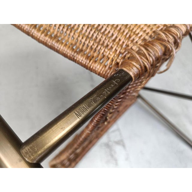 Elegant wicker and bronze lacquered metal dining chairs designed by OscarTusquets for Aleph. Beautiful post modern design....