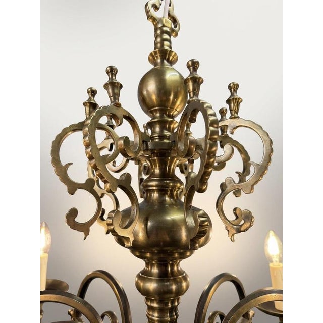 Bring timeless grandeur to your home with this magnificent antique eight-branch Flemish chandelier. Expertly crafted from...