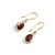 Add a touch of refined vintage elegance to your look with these breathtaking garnet drop earrings. Each earring features a...