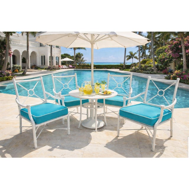 Elevate your indoor or outdoor sanctuary with this striking set of four vintage Palm Beach–inspired accent chairs. Crafted...