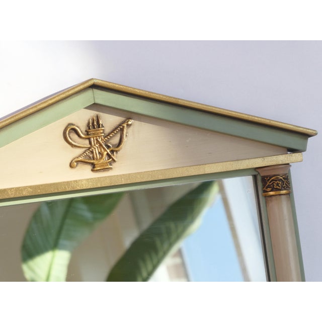 Trumeau mirror in green, beige and golden colours. This empire mirror is originally from France and made out of wood. with...