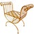 Mid-century 1960s Italian gold gilt wrought iron curule bench in a glamorous Hollywood Regency style. It has been...