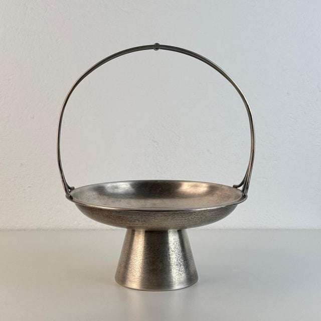 A remarkably elegant and historically charged silver-plated fruit stand / centerpiece designed by gio ponti for arthur...
