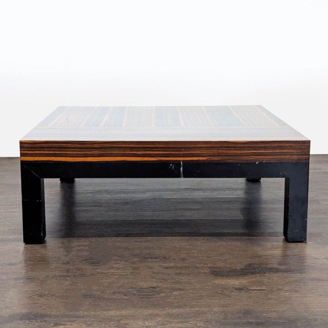 A dramatic square rosewood top with pronounced wood grain, resting on four legs of ebonized oak. Christian Liaigre...