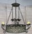 19th century Spanish wrought iron circular chandelier. Six lights in three pairs of two with drip wax candle covers held...